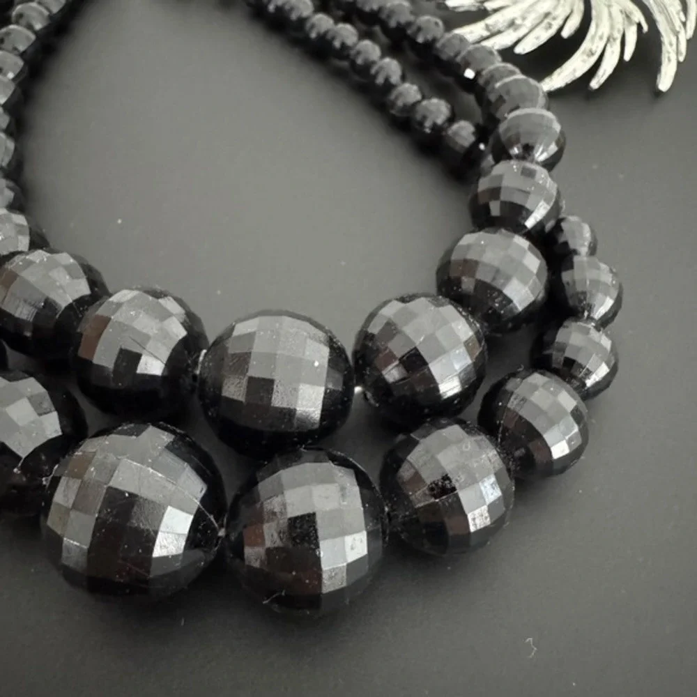 Vintage Black Faceted Bead Two Strand Necklace and Silver Tone Flower Brooch Set